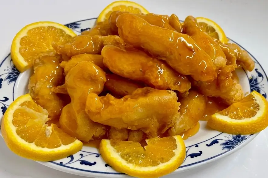 Orange Chicken - Crispy chicken in orange - flavored sweet - n - sour sauce at Lucky Star Chinese Restaurant in North Bend